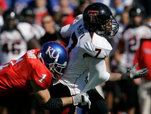 Texas Tech safety Darcel McBath (7) is tackled by Kansas running back Jake Sharp (1) following an interception during the second half of an NCAA college football game in Lawrence, Kan., Saturday, Oct. 25, 2008. Texas Tech defeated Kansas 63-21. (AP)